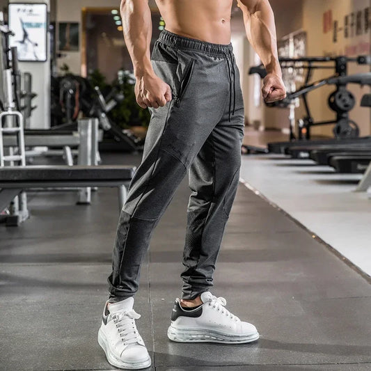 High-quality men's camouflage track pants, ideal for the gym, fitness, and running. Features stretchy, breathable fabric, zippered pockets, and a longer leg