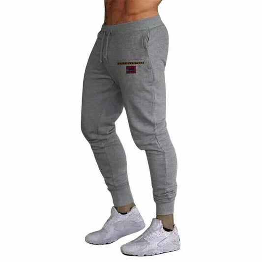 Men's athletic track pants, ideal for jogging and running. Comfortable and casual. Spring/Autumn 2026 collection. Slim fit.